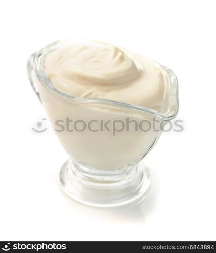 sour cream in bowl on white . sour cream in bowl on white background