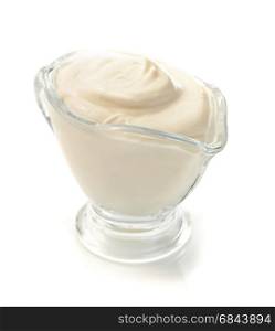 sour cream in bowl on white . sour cream in bowl on white background