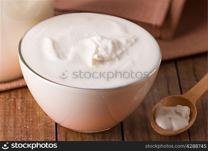 sour cream on wooden background