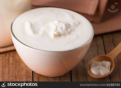 sour cream on wooden background