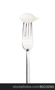 sour pickled onion on a fork. sour pickled onion on a fork. Isolated on a white background
