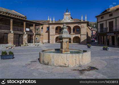 Source and government buildings of the town of ayllon spain
