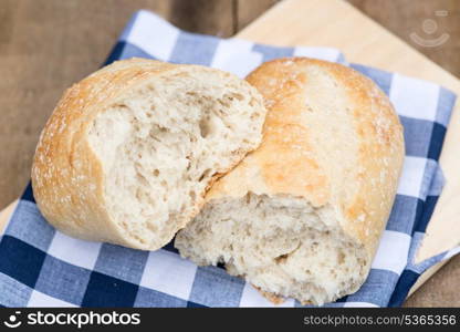 Sourdough loaf of bread in rustic kitched setting