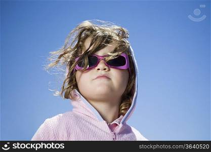 South Africa, Cape Town, girl in sunglasses against clear sky