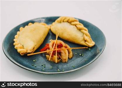 South American empanadas filled with meat and chicken