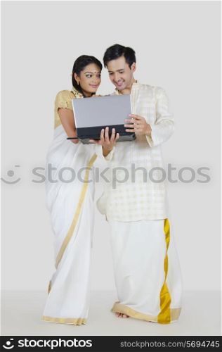 South Indian couple with a laptop