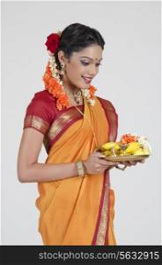 South Indian woman holding a thali