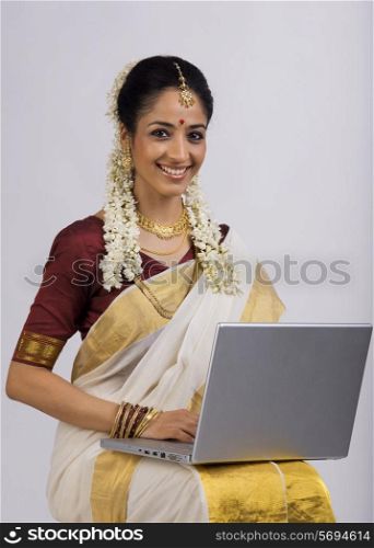 South Indian woman with a laptop