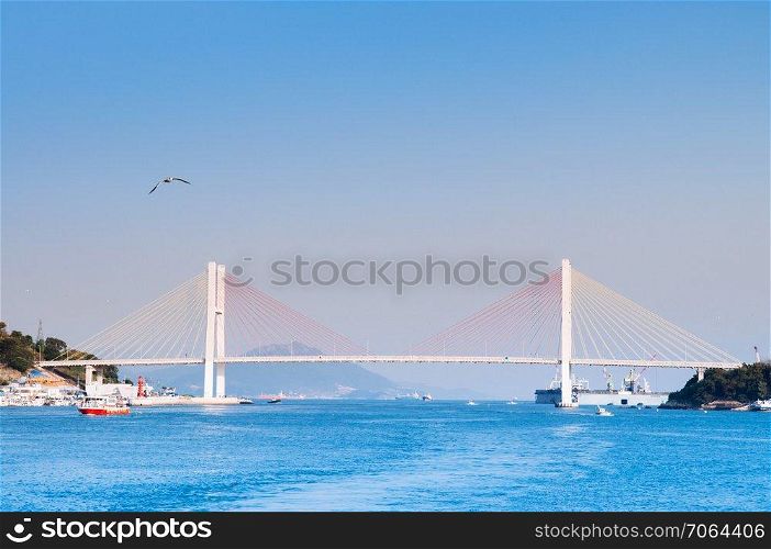 South Korea - Yeosu harbor with Geobukseon or Dolsan-ro 2 bridge, famous landmark to take picture on sightseeing cruise route