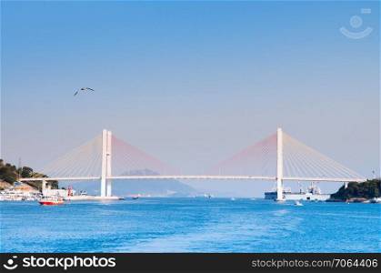 South Korea - Yeosu harbor with Geobukseon or Dolsan-ro 2 bridge, famous landmark to take picture on sightseeing cruise route