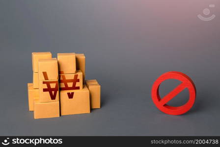 South korean won goods boxes and prohibition symbol NO. Trade wars. Oversupply. Confiscation of contraband. Shortage of goods. Sanctions and embargo. A ban on import of goods.