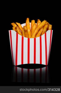 Southern french fries in paper container on black background