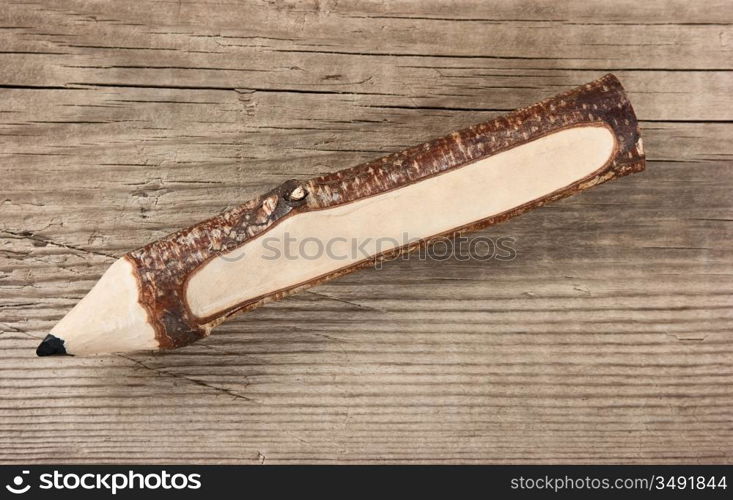 souvenir pencil on wooden background