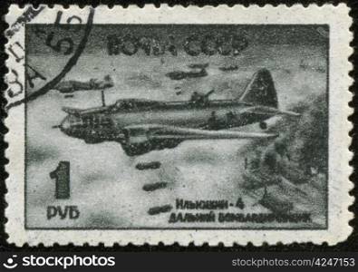 "SOVIET UNION - CIRCA 1945: A stamp printed by the Soviet Union Post is entitled "Ilyushin 4 long haul bomber", circa 1945"