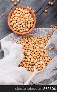 Soy beans in a bowl on wooden table