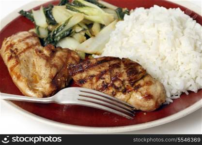Soy sauce marinaded chicken breasts served with sauteed pak choi and Thai Jasmine rice