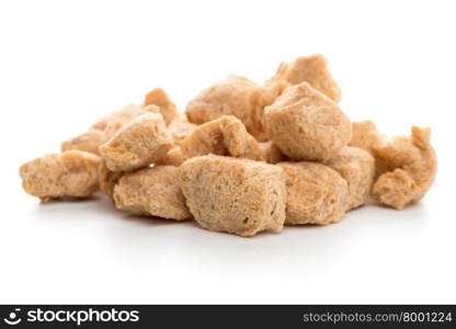 Soya chunks isolated on white background. Closeup.