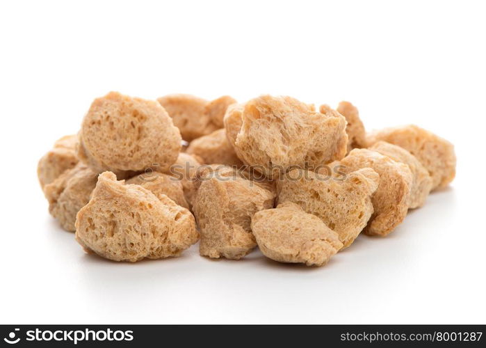 Soya chunks isolated on white background. Closeup.