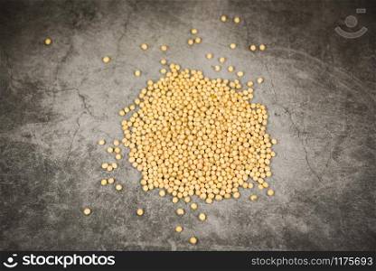 Soybean on black background / dry soy beans agricultural products