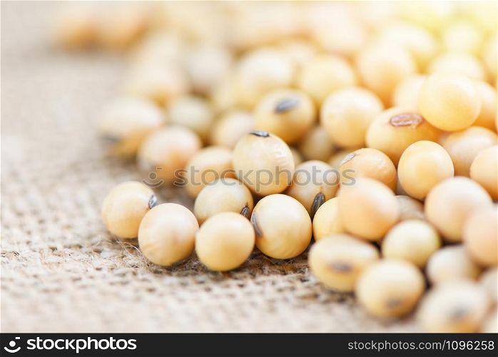 Soybean on the sack background agricultural products / dry soy beans , selective focus