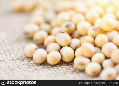 Soybean on the sack background agricultural products / dry soy beans , selective focus