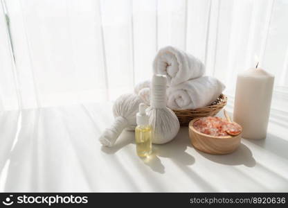 Spa accessory composition set in day spa hotel , beauty wellness center . Spa product are placed in luxury spa resort room , ready for massage therapy from professional service .