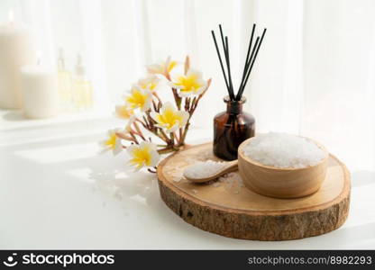 Spa accessory composition set in day spa hotel , beauty wellness center . Spa product are placed in luxury spa resort room , ready for massage therapy from professional service .