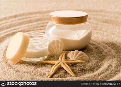 Spa body cream seashell star on sand beauty treatment