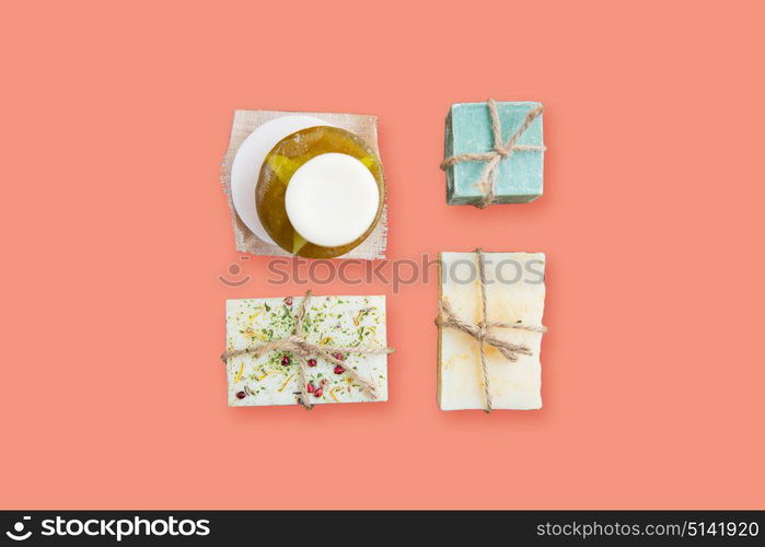 spa, bodycare and natural cosmetics concept - handmade soap bars over pink background. handmade soap bars over pink background