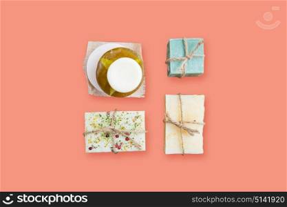 spa, bodycare and natural cosmetics concept - handmade soap bars over pink background. handmade soap bars over pink background