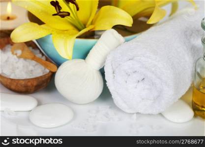 Spa concept (flowers, towel and sea salt) over white