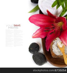 Spa concept (flowers, towel, sea salt and massage stones) (with easy removable sample text)