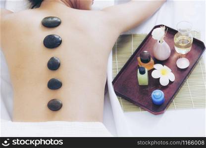 Spa concept.Stone Massage on back relaxation for beautiful woman.