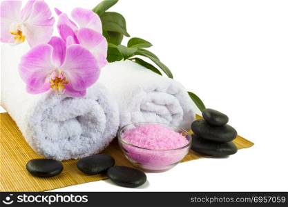Spa concept with pink orchid isolated on white. Spa. Spa treatment. Spa massage. Spa stones. Wellness spa. Spa concept. Spa concept with pink orchid isolated on white