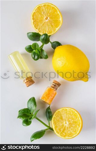 Spa cosmetics with citrus on a white background. Eco product for alternative medicine with lemon. Place for text.. Spa cosmetics with citrus on a white background. Eco product for alternative medicine with lemon.