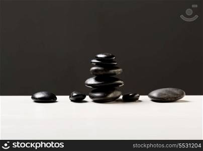 spa, health and beauty concept - closeup of hot massage stones