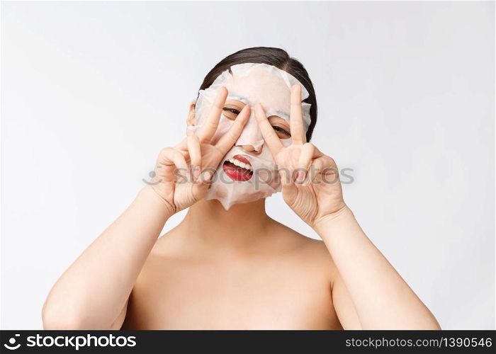 Spa, healthcare. Woman with purifying mask on her face isolated on white background. Spa, healthcare. Woman with purifying mask on her face isolated on white background.