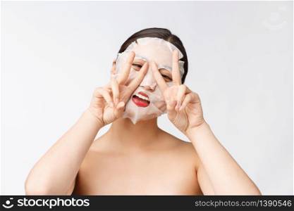 Spa, healthcare. Woman with purifying mask on her face isolated on white background. Spa, healthcare. Woman with purifying mask on her face isolated on white background.
