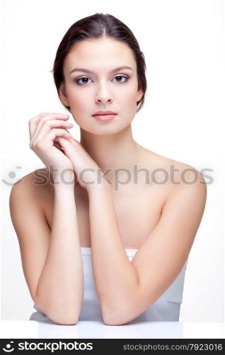 Spa Portrait of Beautiful Young Woman with Long Brown Hair on the White Background