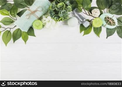 spa products decorated with green leaves wooden surface. Resolution and high quality beautiful photo. spa products decorated with green leaves wooden surface. High quality and resolution beautiful photo concept