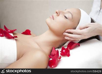Spa salon: Young Beautiful Woman Having Facial Massage