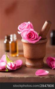 spa set with rose flowers mortar and essential oil