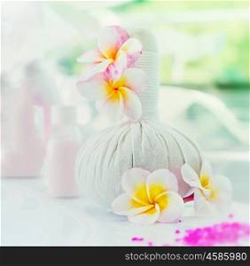 Spa setting with flowers at blurred nature background