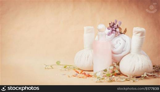 Spa setting with wellness and massage equipment at natural beige background, front view, banner