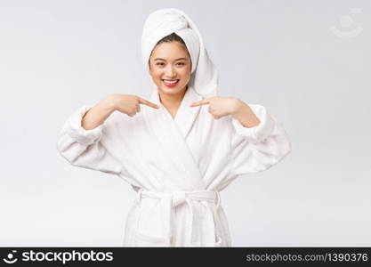 Spa skincare beauty Asian woman drying hair with towel on head after shower treatment. Beautiful multiracial young girl touching soft skin.. Spa skincare beauty Asian woman drying hair with towel on head after shower treatment. Beautiful multiracial young girl touching soft skin