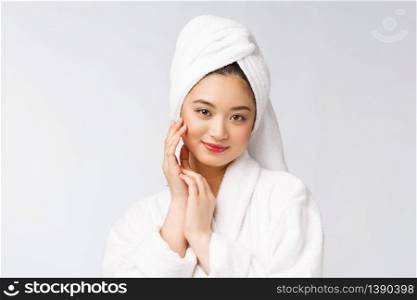 Spa skincare beauty Asian woman drying hair with towel on head after shower treatment. Beautiful multiracial young girl touching soft skin. Spa skincare beauty Asian woman drying hair with towel on head after shower treatment. Beautiful multiracial young girl touching soft skin.