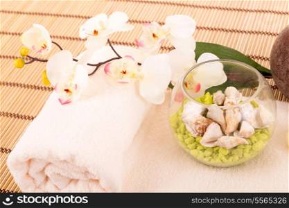 Spa space with some candlers, flowers and towel