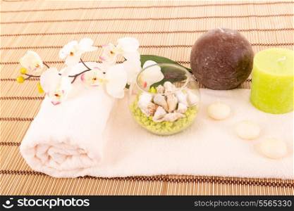 Spa space with some candlers, flowers and towel