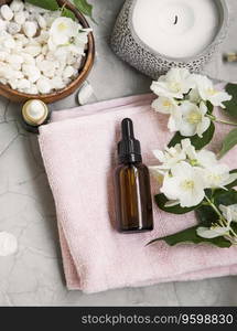 Spa still life with jasmin oil, flowers , bath salt and towels. Wellness and spa flatlay setting