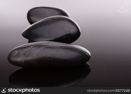 Spa stone arrangement on black surface